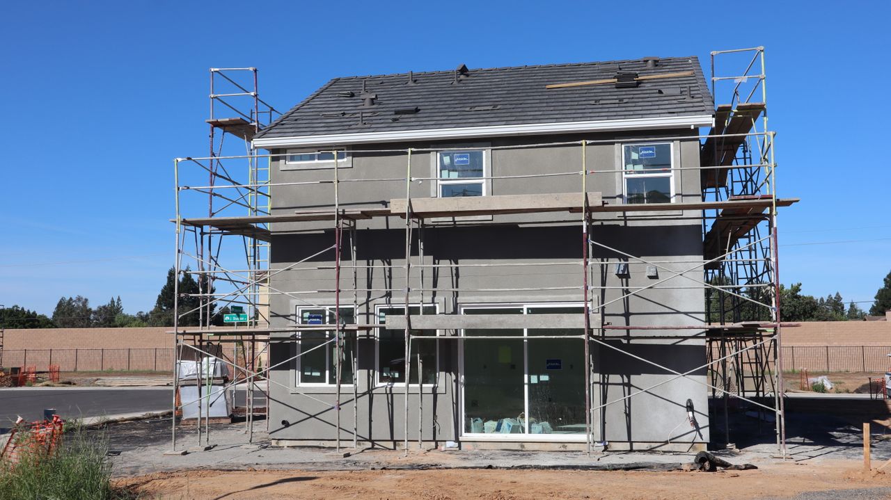 services-03 Scaffolding surrounds a new home under construction in Elk Grove, California.